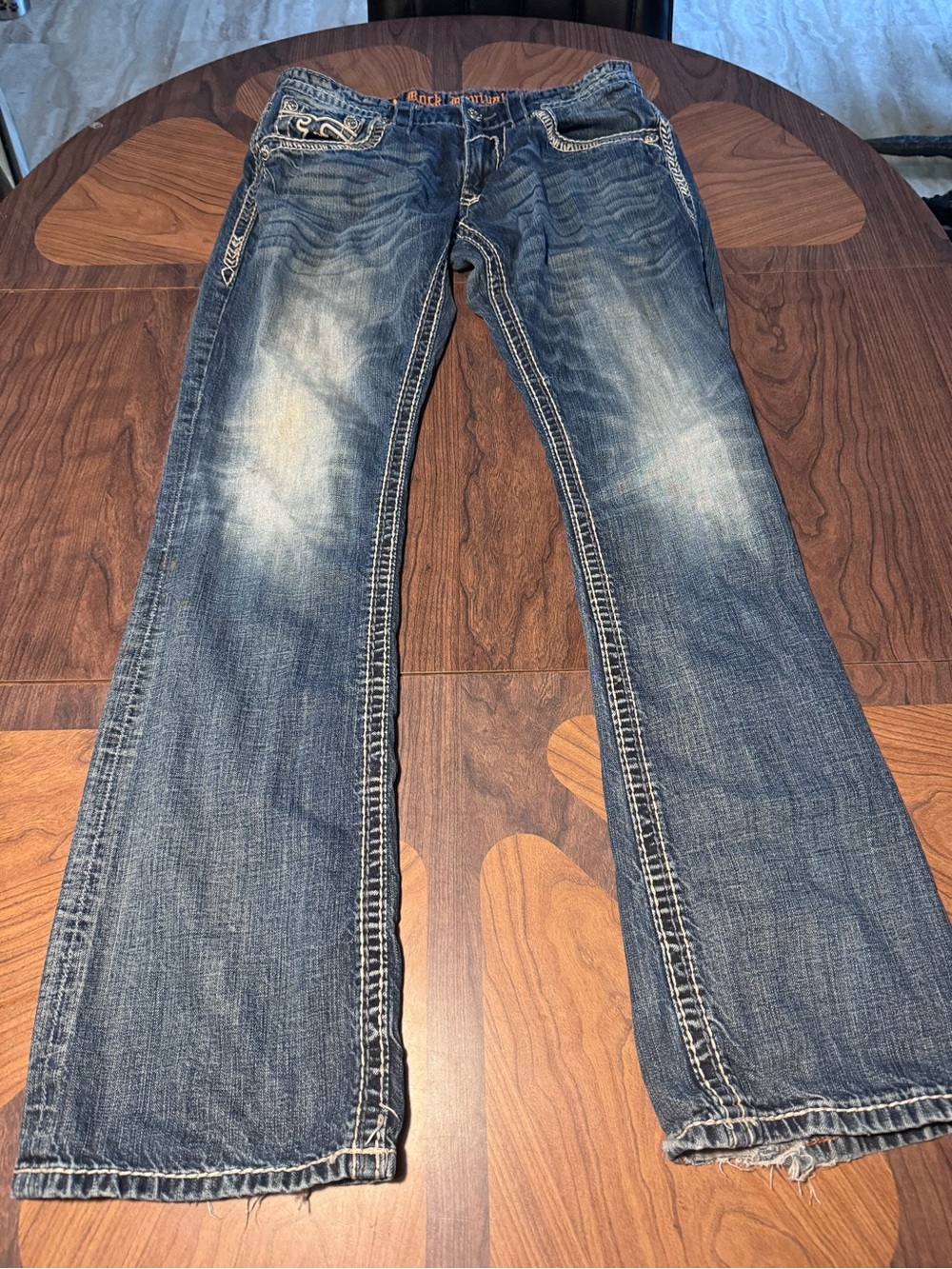 Rock Revival Boot Cut Blue Jeans with Embroidered Pockets